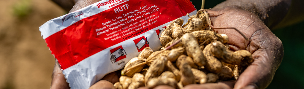 Holding Plumpy Nut and Peanuts